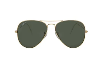 A pair of gold-rimmed aviator sunglasses with green lenses against a white background.