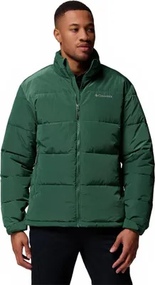 A man wearing a green puffer jacket.