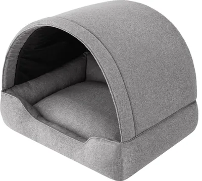 A gray dog bed with a hooded top.