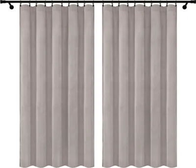 Two gray curtains hanging on a curtain rod.