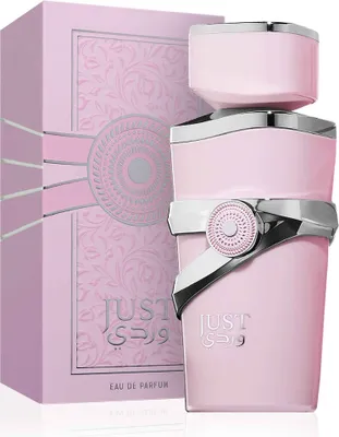 A pink perfume bottle and its matching box are displayed against a white background.