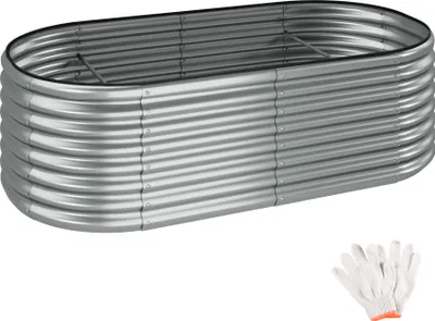 A silver, oval-shaped raised garden bed made of corrugated metal, shown on a white background. A pair of white gardening gloves is placed in the bottom right corner.