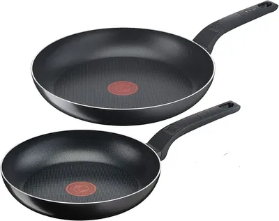Two black frying pans are shown against a white background.