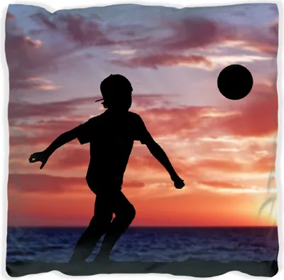 Produktbild von Wallario Premium Kissen, weiche Oberfläche, mit Motiv Fußball - Kleiner Junge spielt im Abendrot, Größe: 60 x 60 cm, mit weißer Rückseite
