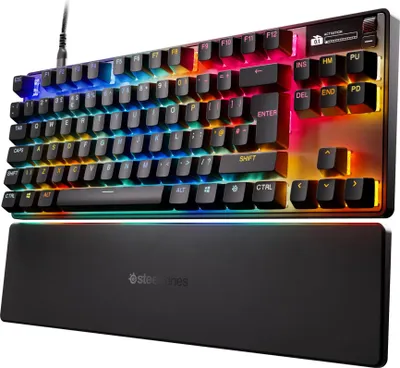 A SteelSeries gaming keyboard with RGB lighting and a wrist rest.