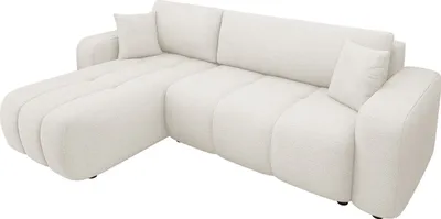 A white sectional sofa with a chaise lounge.