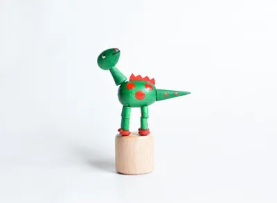 Produktbild von Holzspielzeug Wackelfigur Dinosaurier grün Höhe=9cm NEU