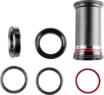 A collection of bicycle bottom bracket components arranged on a white background.