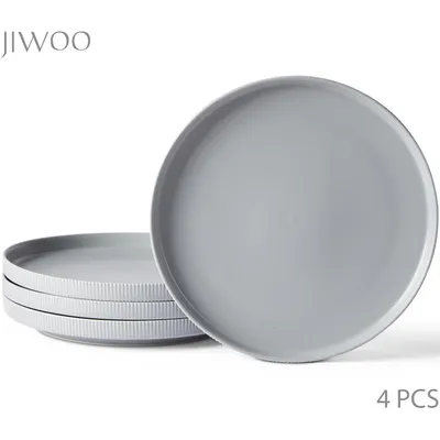 A stack of four gray plates, with one plate prominently displayed in the foreground.