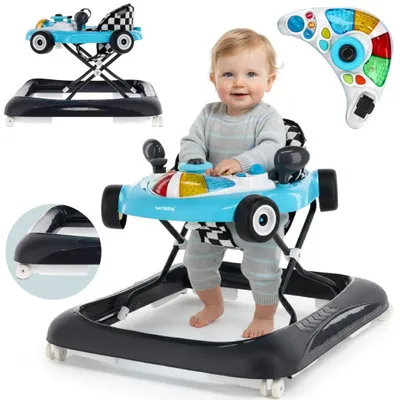 A baby sitting in a blue and black baby walker designed to look like a race car, with a remote control shown separately.