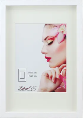 A white picture frame with a mat and a picture of a woman's face.