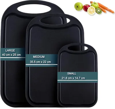 Three black cutting boards of different sizes are displayed side-by-side. A small inset image in the top right corner shows various fruits and vegetables.