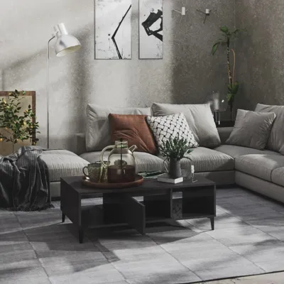 A living room scene with a sectional sofa, coffee table, and floor lamp.