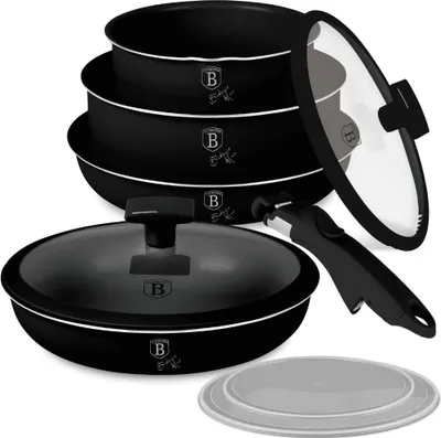 A set of black cookware with glass lids and a detachable handle, arranged on a white background.