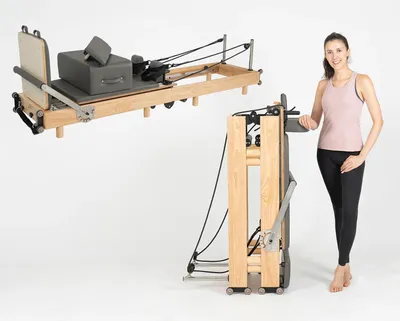 Zdjęcie produktu dla Reformer do pilatesu – urządzenie treningowe – składana drewniana rama – regulowany opór – do użytku domowego – trening siłowy – trening klatki piersiowej