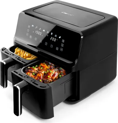 A black dual-basket air fryer with food in both baskets, displayed on a white background.
