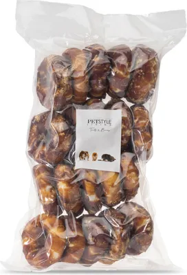 A clear plastic bag filled with dog treats.