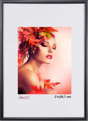 A woman with autumn leaves in her hair and on her shoulder, with a soft pink background.