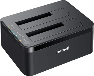 A black Inateck dual-bay docking station for hard drives is shown from a slightly elevated front-right angle on a white background. Indicator lights and labels are visible on the front-left corner.