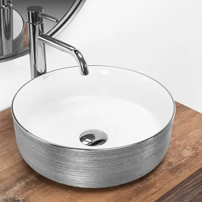 A close-up view of a modern bathroom sink with a faucet.