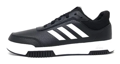 A side view of a black Adidas sneaker with white stripes on a white background.