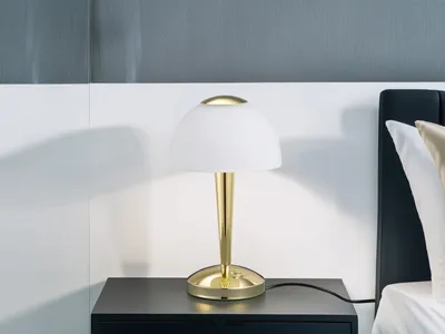 A bedside table with a lamp.