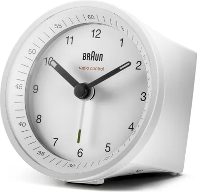 A white Braun radio-controlled alarm clock is shown from a slightly angled side view against a white background.