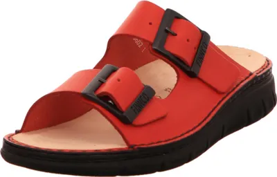 A single red sandal with black buckles is shown against a white background.