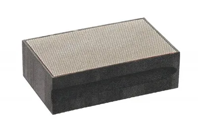 A rectangular sharpening stone with a textured surface.