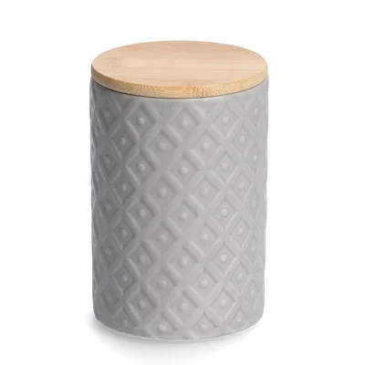 A gray ceramic storage jar with a textured pattern and a bamboo lid, isolated on a white background.