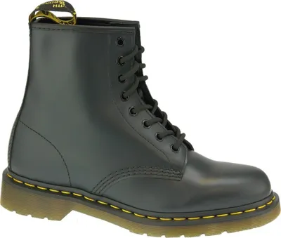 A black Dr. Martens boot on a white background.