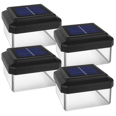 Four solar-powered fence post lights are arranged in a grid on a white background.