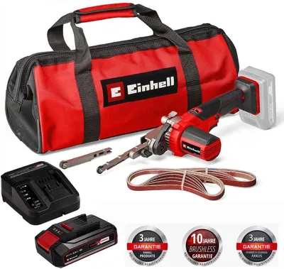 A collection of Einhell brand tools and accessories, including a belt sander, battery, charger, and bag.
