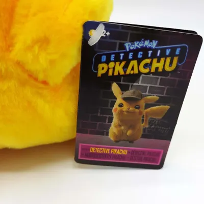A close-up of a Detective Pikachu plush toy tag.