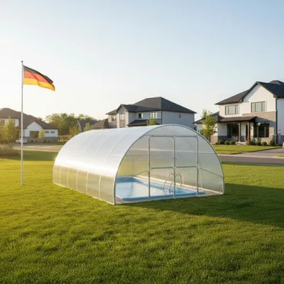 A covered swimming pool in a residential backyard with houses in the background and a German flag.