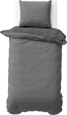 A top-down view of a gray duvet cover and pillowcase set laid out on a white surface.