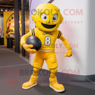 Produktbild von Maskottchen REDBROKOLY Kostümfigur mit gelbem American-Football-Helm bekleidet mit Laufshorts und Kummerbunds