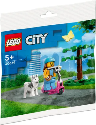 A LEGO City polybag showing a girl on a scooter with a dog in a park setting.