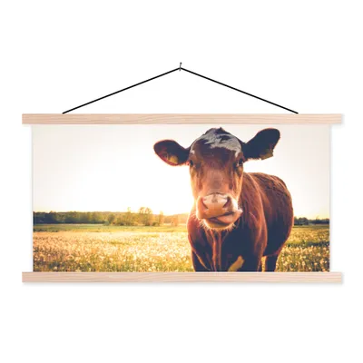 Produktbild von MuchoWow® Textilposter Kuh - Sonnenuntergang - Blumen - Gras - Tiere 60x30 cm mit holzfarbenen Rahmen - Dekoration