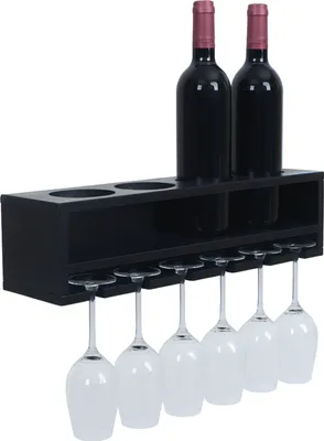 A black wooden wine rack mounted on a white background, holding two bottles of red wine and six wine glasses.