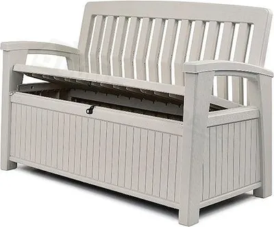 A white storage bench with its lid open, showing the storage compartment inside.