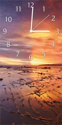 Produktbild von Wallario Design Wanduhr bedruckt, Größe 30 x 60 cm, Motiv: Wattwanderung am Meer bei Sonnenuntergang
