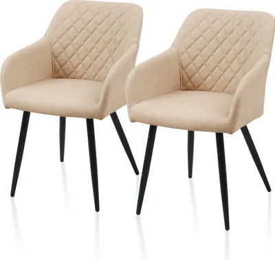 Two beige upholstered dining chairs with black legs are shown against a white background.