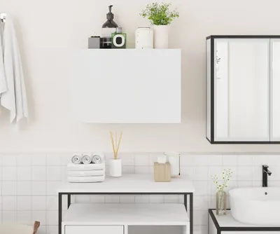 A clean, modern bathroom scene featuring a white wall-mounted cabinet, a sink, and various bathroom accessories.