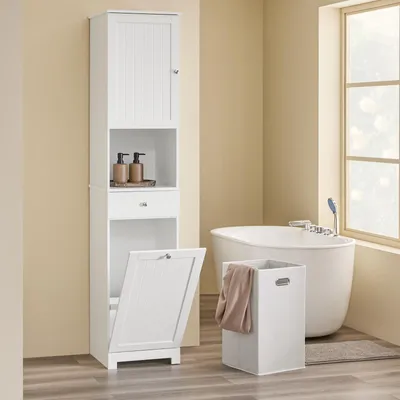 A white bathroom cabinet with a laundry hamper in a bathroom setting.