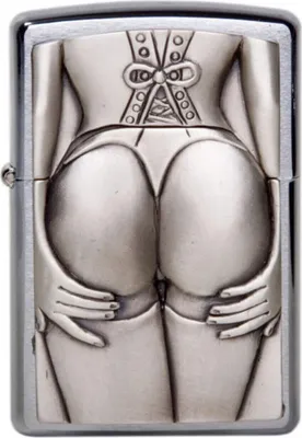 A close-up, front-facing view of a silver Zippo lighter with an embossed design of a woman's posterior in lingerie.
