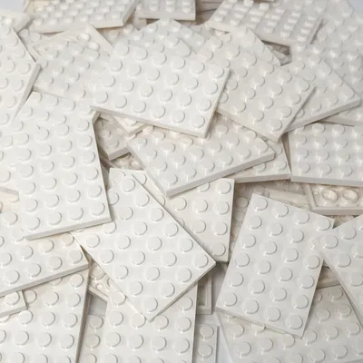 A pile of white LEGO® 4x6 plates.