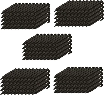 Multiple stacks of black garden stakes arranged in rows on a white background.