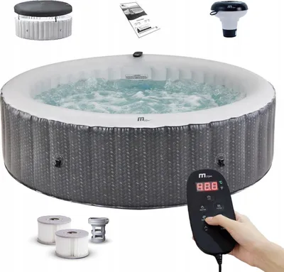 An inflatable hot tub with accessories and a remote control.