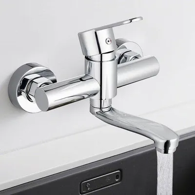 Produktbild von Wandarmatur für die Küche – Mischarmatur aus Edelstahl – Kalt- und Warmwasser – 360 Grad schwenkbar – 15 cm Schwenkarm – Chrom